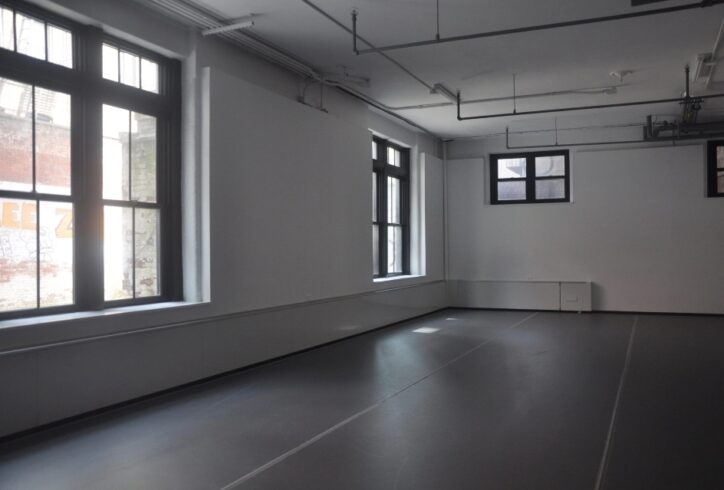 Photo of empty dance studio with large windows