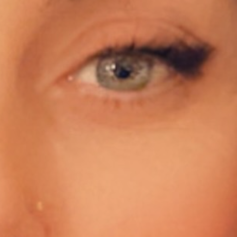 Kate Watson-Wallace bio photo; A close up of an eye.