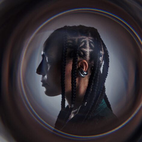 This shows Anaïs' profile, her eyes are closed and her ear is at the center of the frame. Her head is surrounded with a circle of light. Photo by Sean Webley.