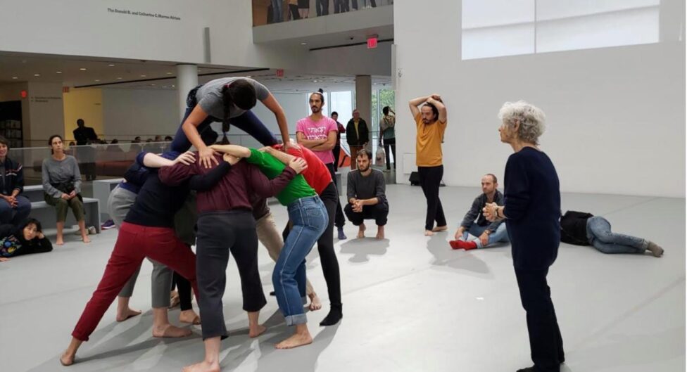 Martita (top) rehearsing “Huddle” with Simone Forti (right) and the cast of Dance Constructions at the Museum of Modern Art. 