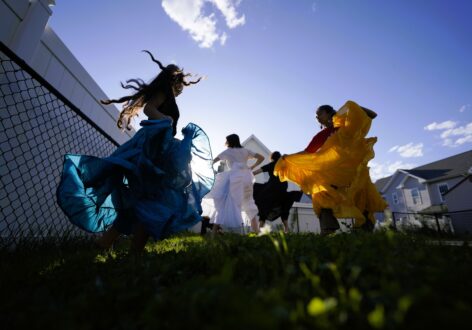 Ani/MalayaWorksancers dance with Bomba skirts in a North Philadelphia backyard as a way to keep culture. Photo courtesy of artist.