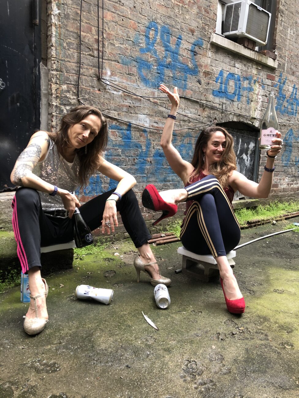 Catherine Cabeen and Kristina Berger in Glitter in the Gutter: The Morning After, 2021. Glitter in the Gutter is an ever-evolving 2-women comedy show, which ran from 2018-2023, that uses camp and irony to shimmy struggles into laughter.
