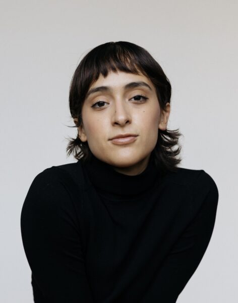 A portrait of Andrea Soto. Her skin is light brown, her eyes are dark brown and so is her hair. Photo by Alex Munro.