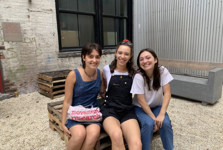 3 Interns sit together at the intern party at 122CC. Photo from the MR Archives 2019.