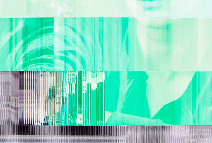 a digital photo that has a datamosh quality to it. The face of Laurel is featured mostly in shades of green, and the pixels seem to jam and striate up against one another as if the photo has been chiseled into the side of a mountain. Her arms appear at the bottom of the photo, the aspect of the image that can been seen as 