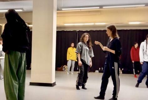 A group pf dancers more through the space in a dance studio. Photo courtesy of the artist.